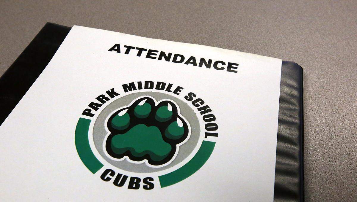 An attendance book sits on the counter in the main office at Park Middle School in Kennewick.