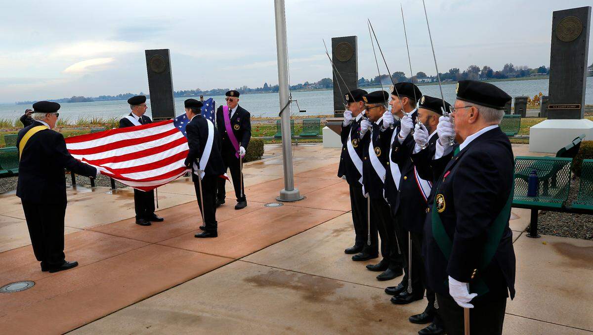 Member of the Richland Knights of Columbus Honor Guard take part in the flag raising ceremony during Monday’s Veterans Day ceremony at the Regional Veterans Memorial in Kennewick’s Columbia Park.