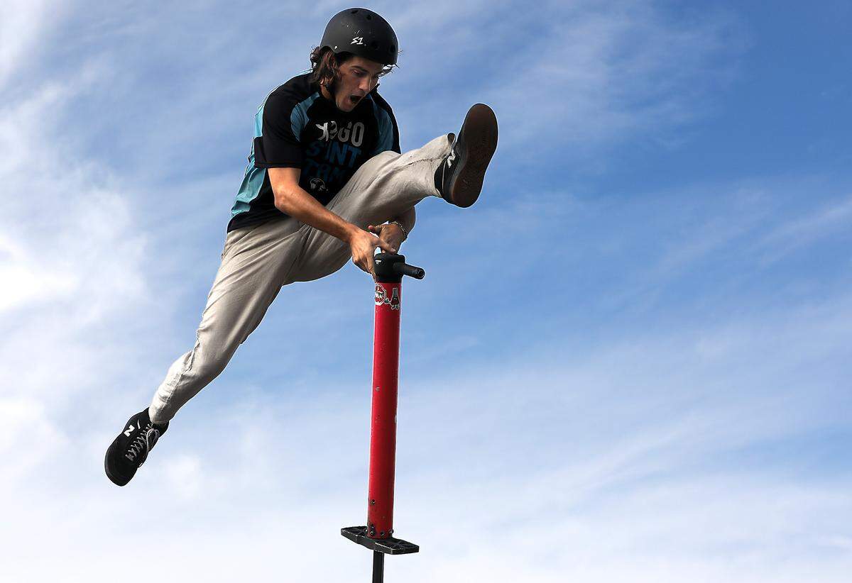Henry Cabelus, a member of the XPogo Stunt Team, performs stunt moves high above the ground during Wednesday’s performance at the Benton Franklin Fair & Rodeo in Kennnewick.