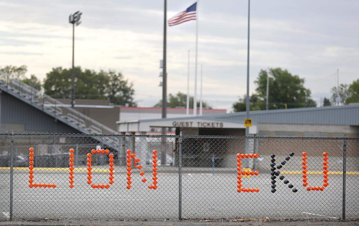 Colorful plastic cups spell out a message of support for the class of 2020 at Kennewick High School in the fence near Lampson Stadium.