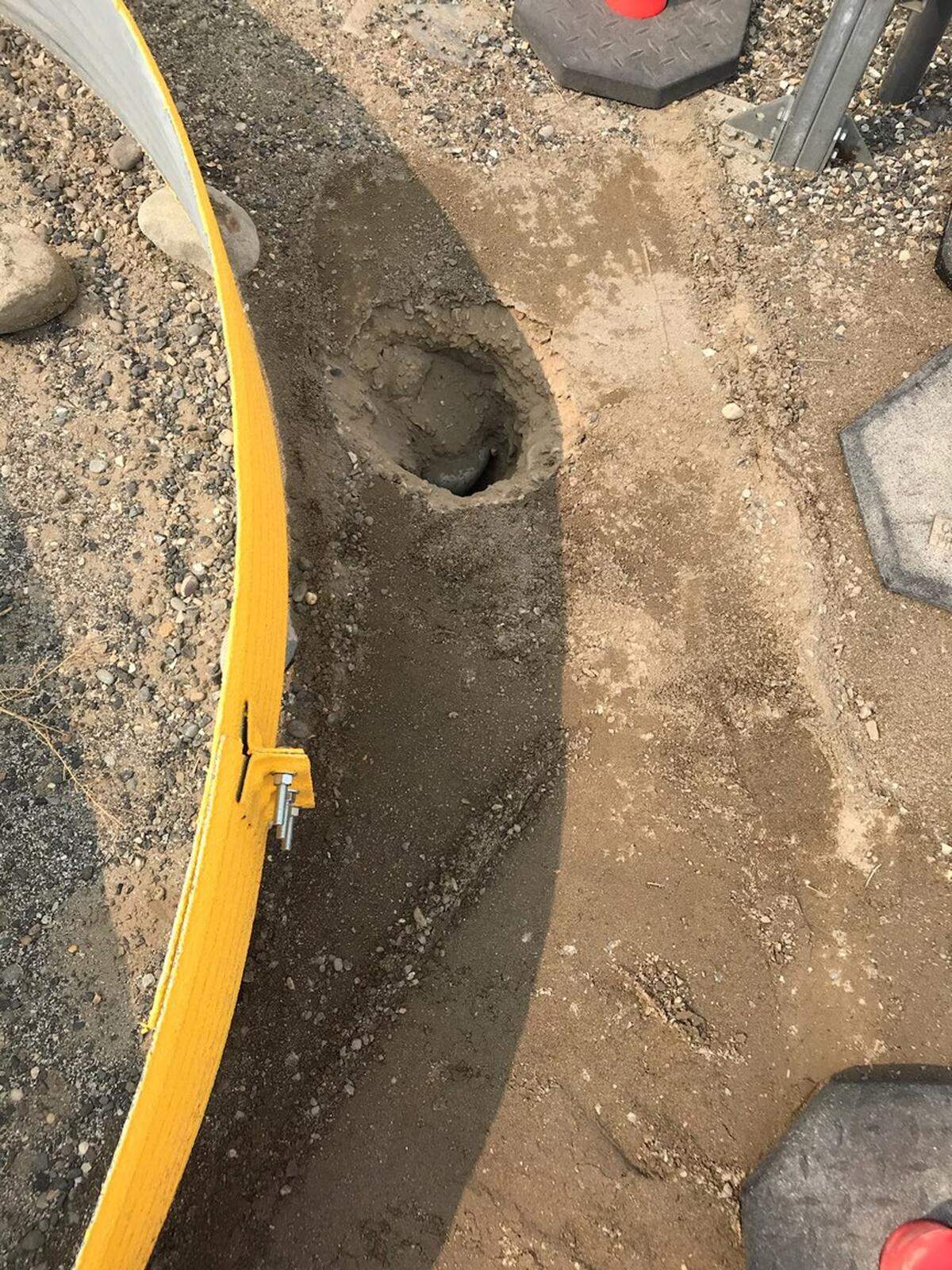 An unexpected hole discovered near a Hanford waste storage tank on Thursday has caused work to stop. The yellow ring is about 1.5 feet high and marks a work area.