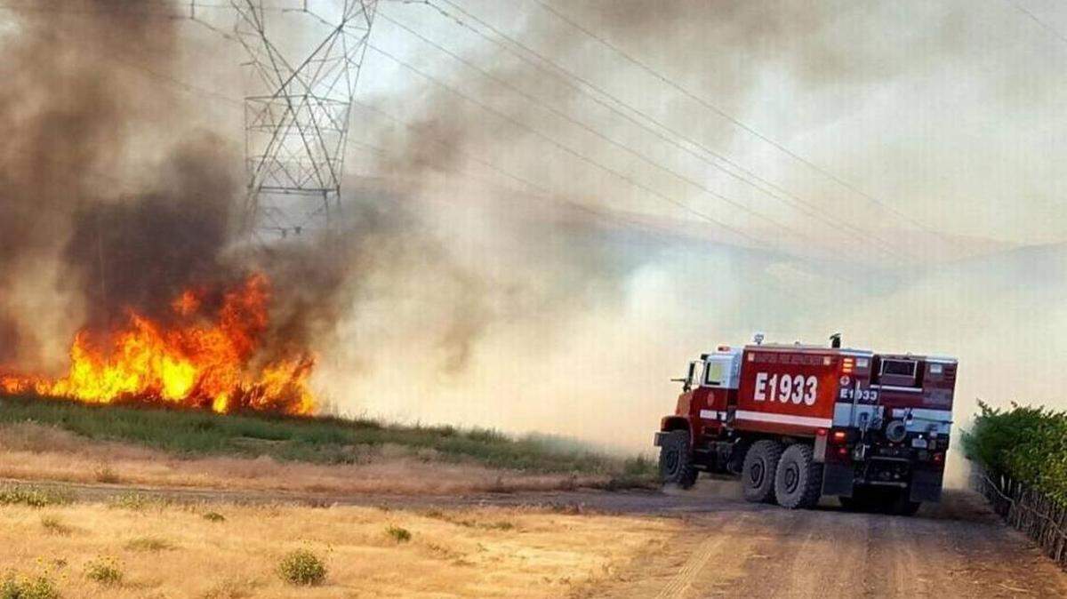 Hanford fire crews fight the Silver Dollar Fire north of the Hanford Site a year ago.