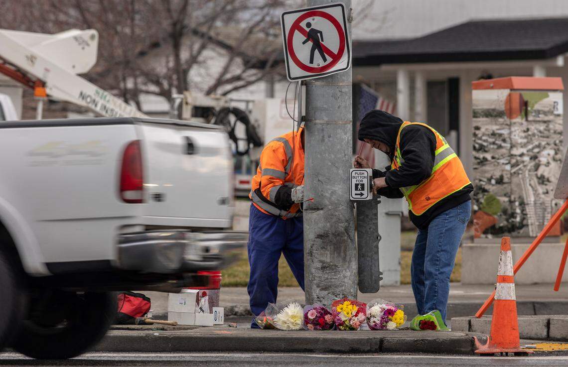 Richland utilites workers make repairs to a signal pole at the intersection of George Washington Way and Jadwin Avenue after a car slammed into the pole at 2:45 a.m. on Sunday, shearing the car in half and impaling it on the light pole. Three passengers died instantly and the driver, Jennifer Duong, 19, was treated at a hospital for injuries before being arrested on suspicion of three counts of vehicular homicide.