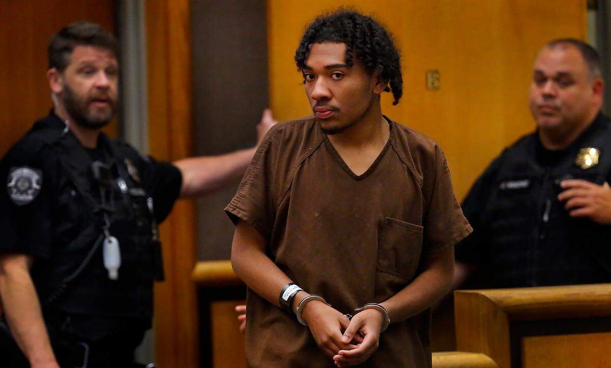 Jacob Young, 18, walks into Benton County Superior Court for his arraignment on a first-degree murder charge in the April shooting death of Ricardo Rivera in Kennewick.