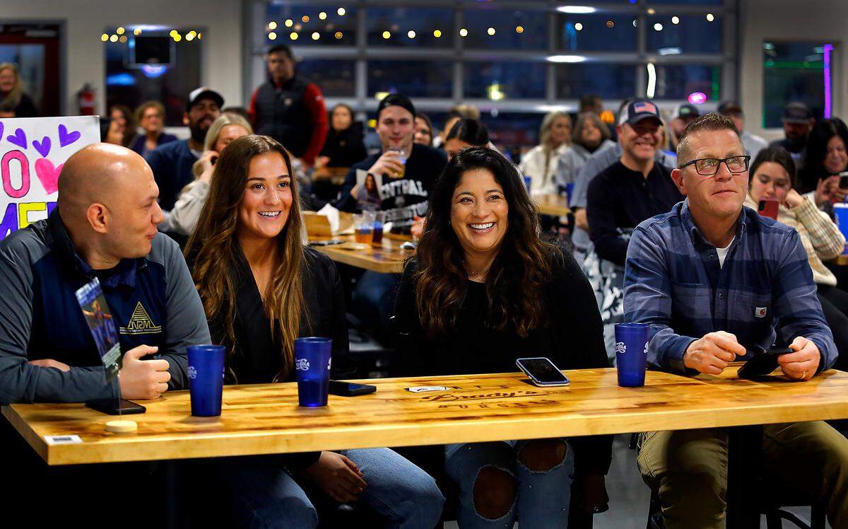 Chiawana High School grad Summer Yates, second from left, sits with her parents Kandy and Blake Yates and her sports agent Jason Jennings, far left, of Narrow Pathway Management, during her National Women’s Soccer League draft party in Kennewick.