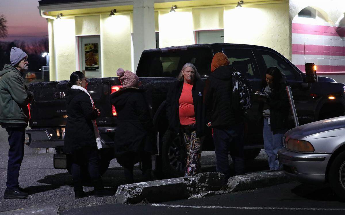 Volunteers and various staff members taking part in the annual Point in Time homeless count talk to a young man just off Vista Way in Kennewick. He told them he had been walking around all night to keep warm. From left, they are: Pat Garndener, Niria Lucatero, Maria Perez, Ronni Batchelor and Lucy Contreras.