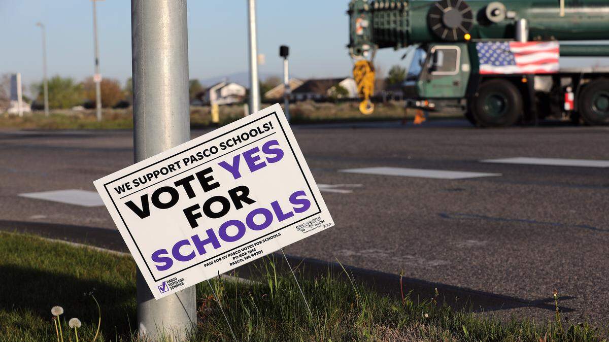 A support Pasco Schools sign for an upcoming levy vote is stuck in the ground on East A Street near the intersection with Heritage Boulevard in Pasco. Taken April 8, 2026.