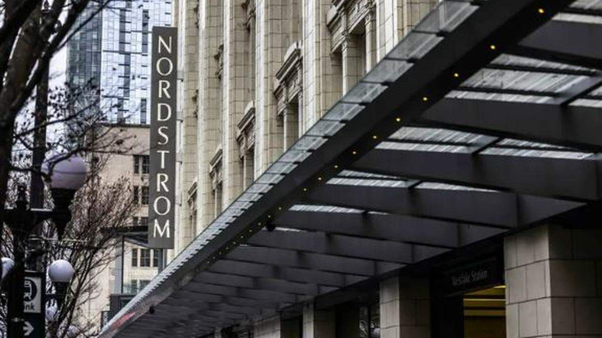 The Nordstrom flagship store sign hangs in Seattle in February 2023. The Nordstrom family offered to take the company private with the backing of a Mexican department store.