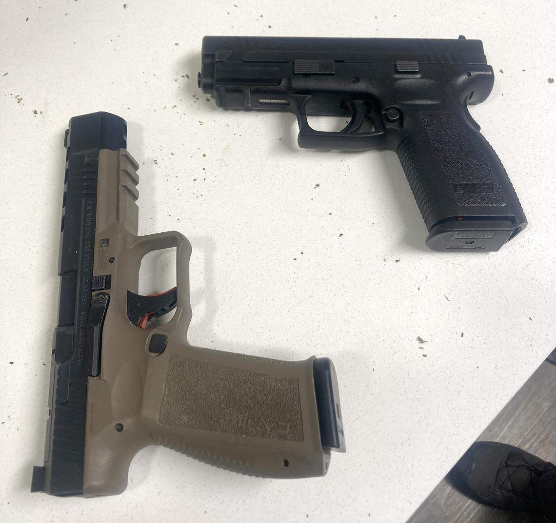 Officers seized two handguns, including one reported stolen in Oregon, from Raymond Smith’s apartment.