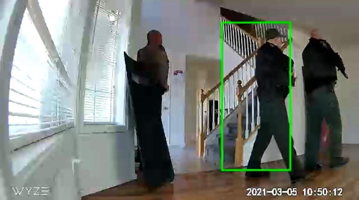 Deputies, seen on security camera footage, had to check all rooms of the house before cornering Aaron C. Kelly in his upstairs bedroom