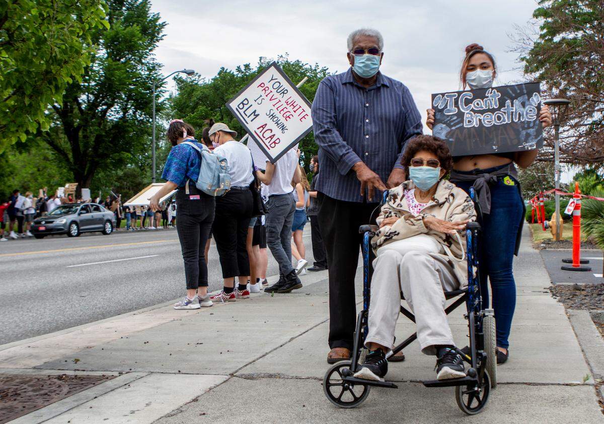 Dallas and Lozie Barnes join Black Lives Matter protesters during a recent rally.