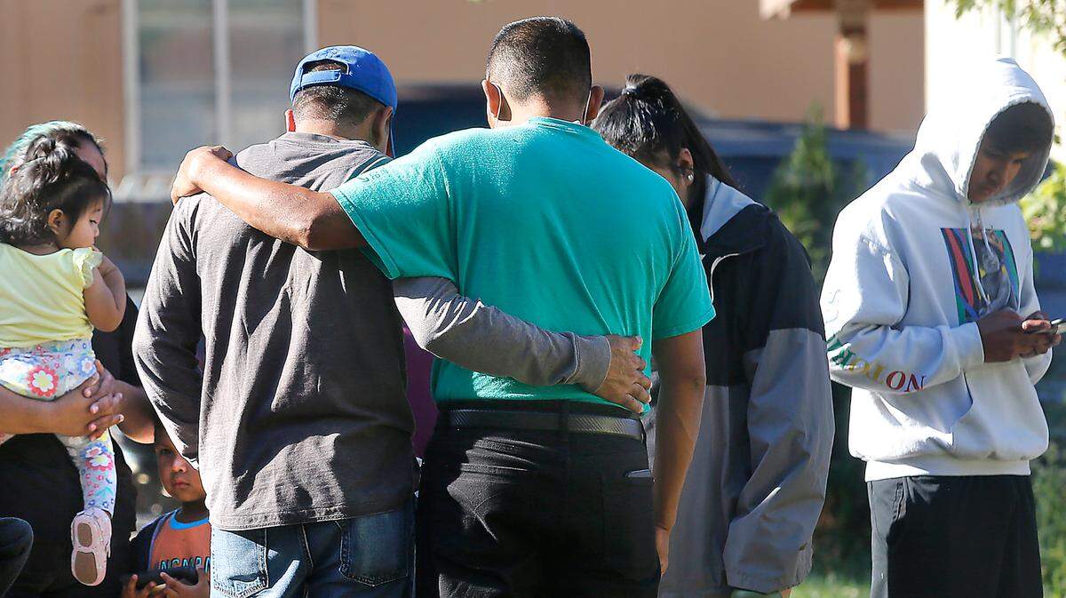Its a somber gathering for friends and neighbors as they console each other across the street from the site of Thursday’s fatal fire at the Green Acres Mobile Home and RV Park in Benton City. A mother and her three kids were killed in the blaze.