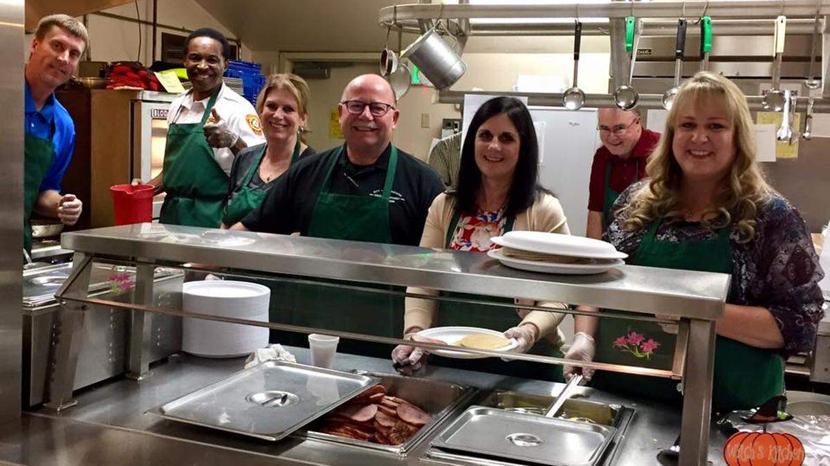Kennewick City Manager Marie Mosley, fifth from right, serves up breakfast at the 26th annual pancake breakfast benefiting United Way of Benton and Franklin Counties in 2017.
