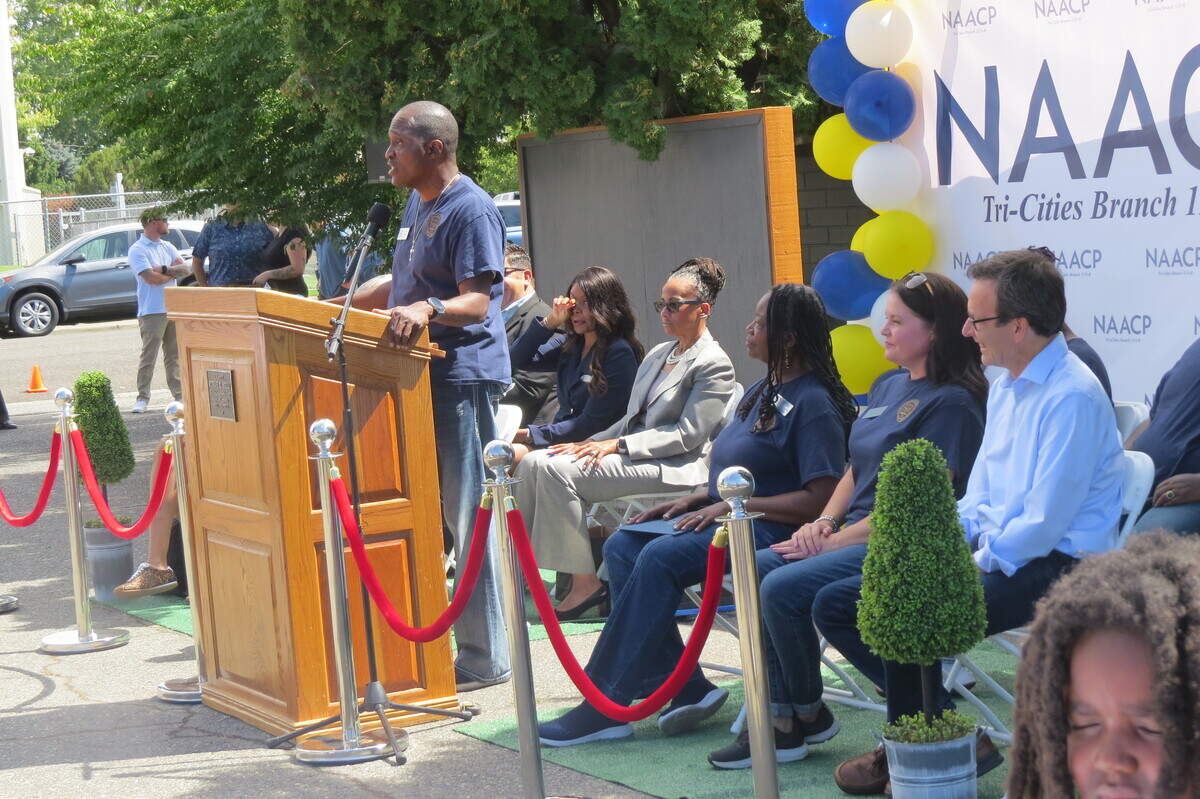 NAACP of Tri-Cities Chapter President Irving Brown speaks during a ribbon-cutting ceremony at the new offices of the NAACP of Tri-Cities chapter building.