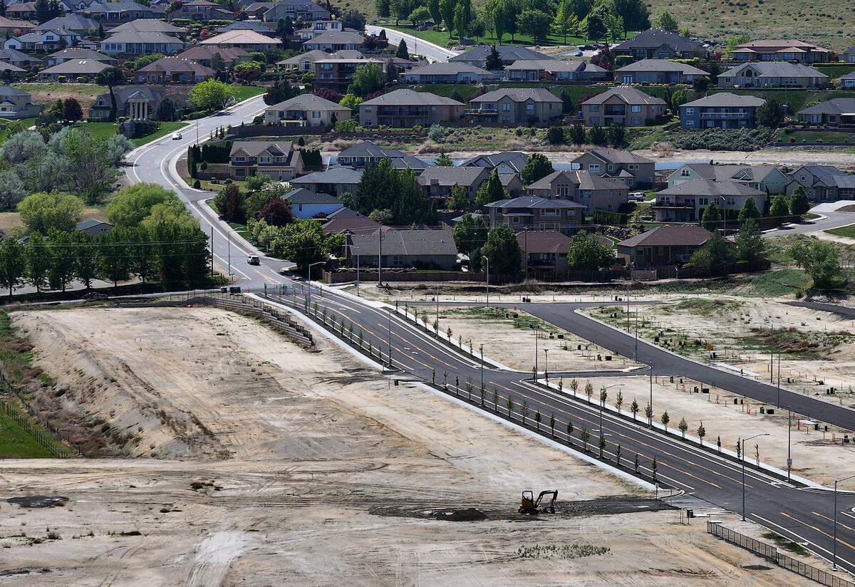 The extension of Queensgate Drive at Keene Road in south Richland is still closed to traffic. The newly paved stretch was put in by the developer.