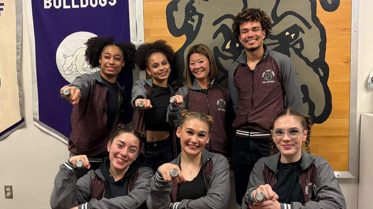 The members of the Pasco High School hip-hop dance team with their coach, Becca Schwan, sporting their Dance Team Union National Champion rings and jackets.