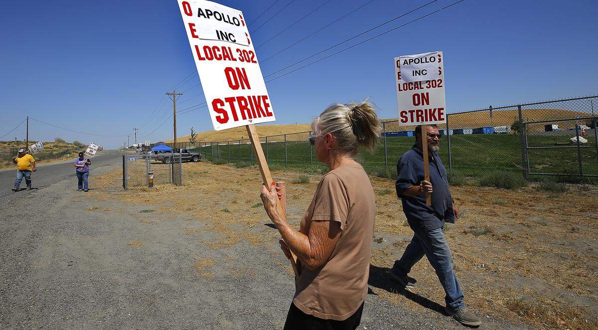 Construction sites across the Tri-Cities and beyond were idled Tuesday as the International Union of Operating Engineers Local 302 went on strike. These workers are outside the entrance to the Horn Rapids Landfill in Richland.
