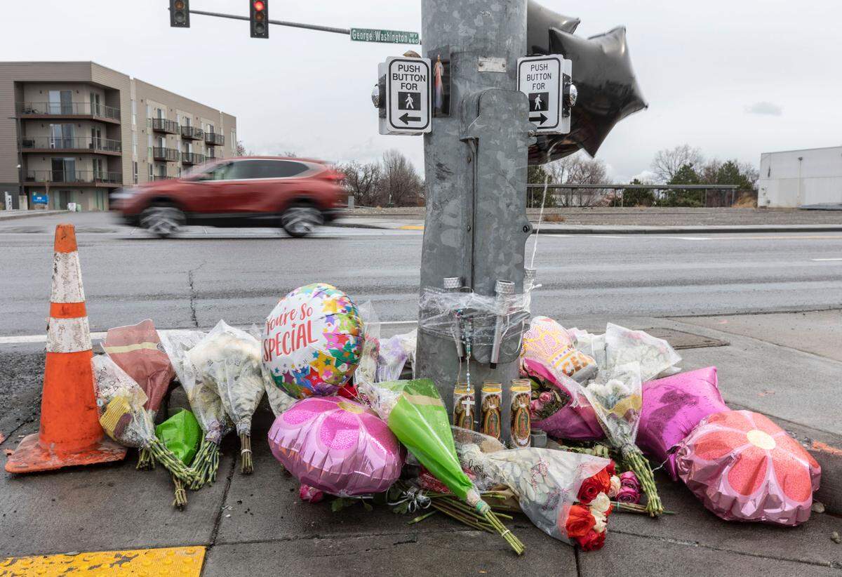 Family and friends left a memorial for the three victims of a February 2022 crash at the intersection of George Washington Way and Jadwin Avenue.