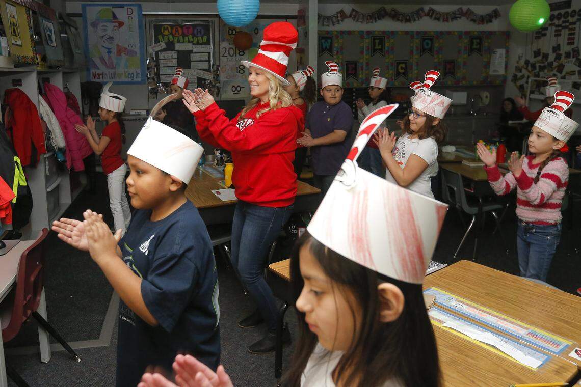 Hawthorne Elementary School’s third-grade teacher Kris Mars dances with her students as a part of their brain break on Wednesday, Feb. 28 in Kennewick. After her students have been working hard in class they are rewarded with a break called brain break. She lets the students decide what their break will be from reading to dancing.