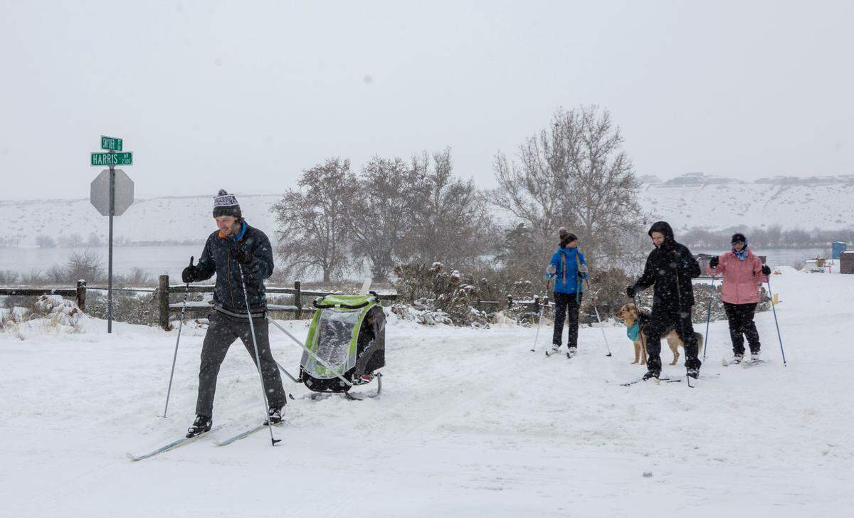 Some cross country skiers take advantage of snowfall in Leslie Groves Park in Richland.