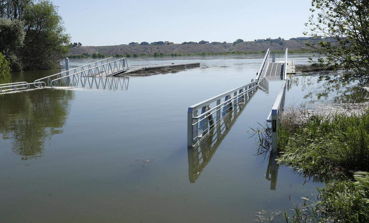 The walkways for the Snyder Street boat launch in Richland's Leslie Grove Park are partially submerged as high Columbia River water flows are causing minor flooding along the Richland shoreline.