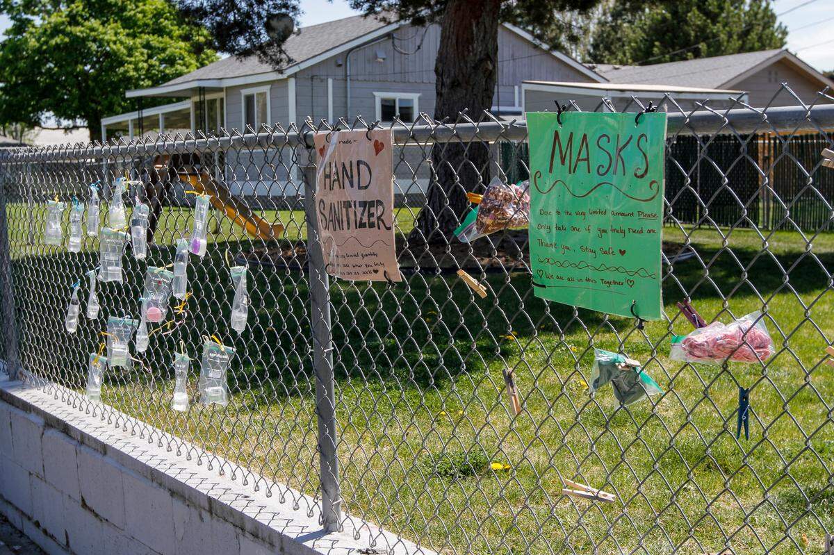 Mary Arquette distributed 4,500 masks from the fence in front of her home on the corner of Lee Boulevard and Smith Avenue in Richland.