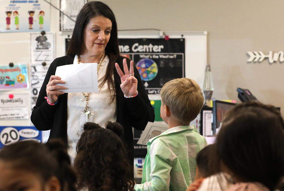 Transitional Kindergarten teacher Millea DeAngelo conducts a classroom exercise recently at Keene-Riverview Elmentary School in Prosser. The program, designed to prepare 4-year-olds for kindergarten, is facing cuts in state funding.