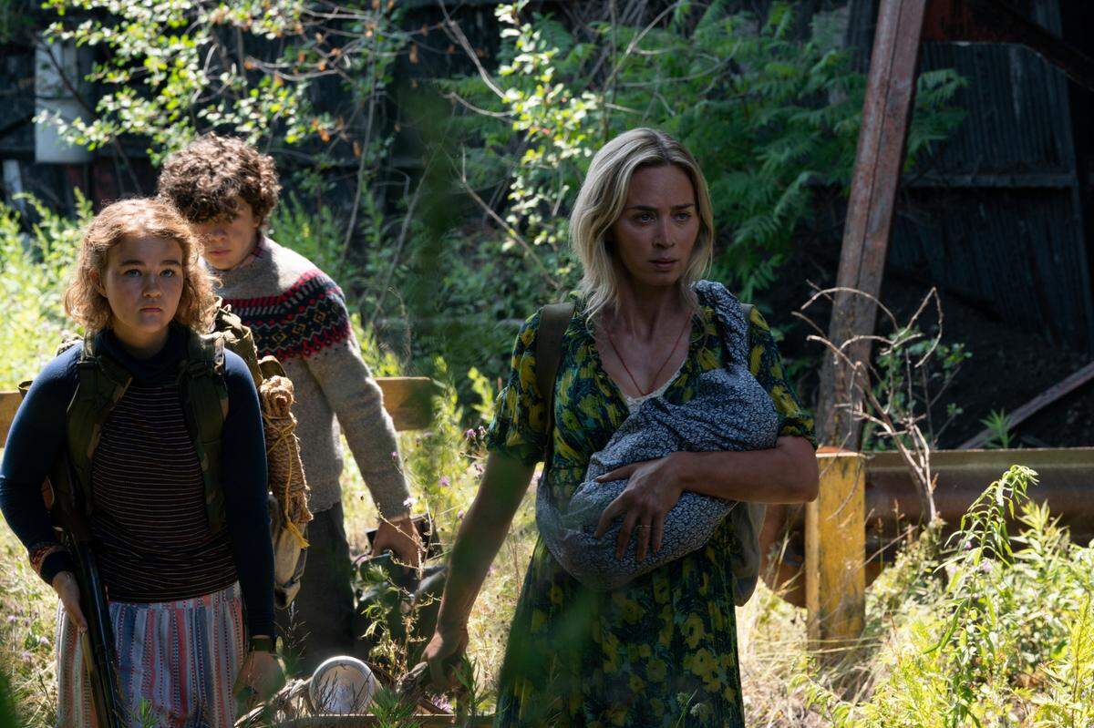 Regan (Millicent Simmonds), Marcus (Noah Jupe) and Evelyn (Emily Blunt) brave the unknown in “A Quiet Place Part II.”