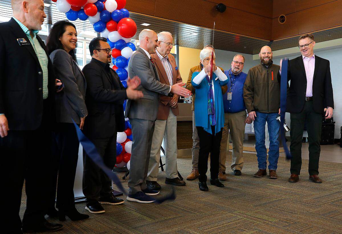 Local dignitaries take part in the ribbon cutting ceremony Thursday for the inaugural American Airllines flight with new non-stop service to Phoenix Sky Harbor International Airport at the Tri-Cities Airport in Pasco.