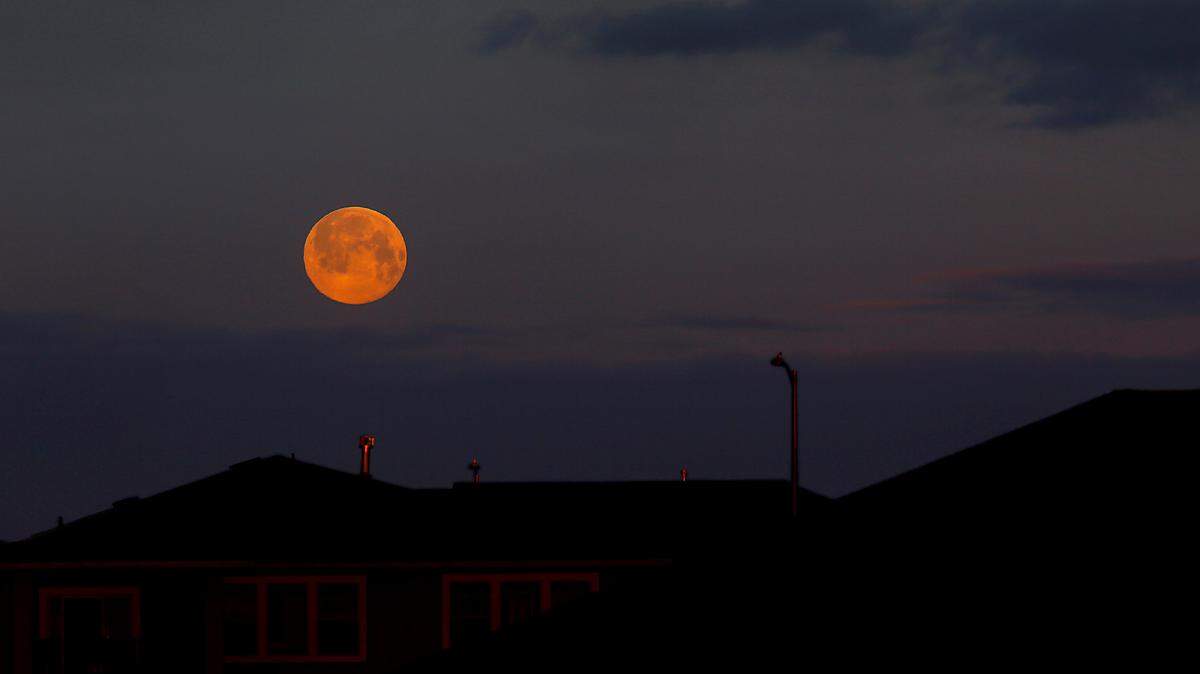 The full moon is still visible in the western sky over the Southridge area in Kennewick on Tuesday shortly after sunrise. The National Weather Service forecast for Wednesday calls for partly sunny skies, then a chance of rain and a little snow by Thursday night and some rain possible Friday before clearing on the weekend