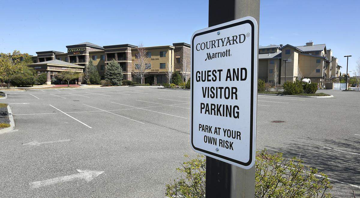 The connected parking lot for The Courtyard by Marriott and The Lodge at Columbia Point hotels in Richland is empty of vehicles because of the impact from the coronavirus outbreak on travelers. The Lodge remains open but is operating with a reduced workforce.