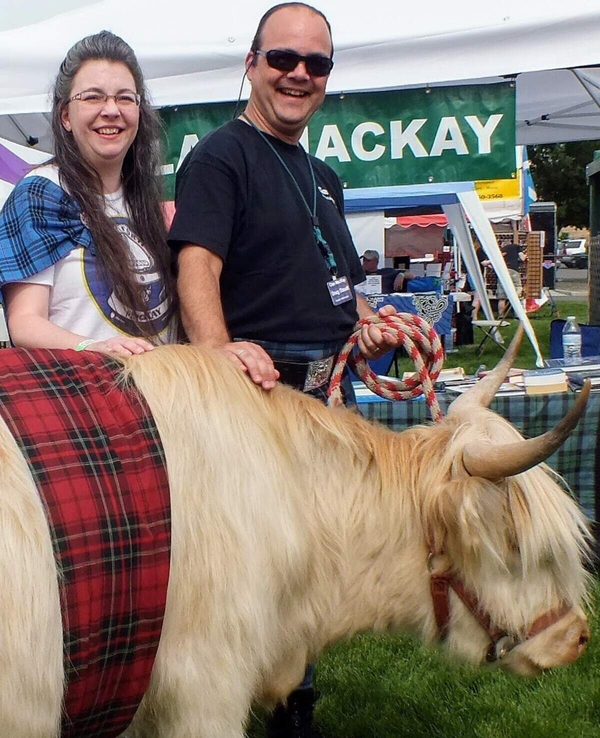 Clan MacKay walks the festival’s highland cow mascot, Hope, around the event.