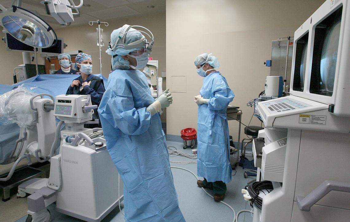 Health services and education added 1,000 positions in the Tri-Cities since last September. These nurses and doctors are in an operating room at Kadlec Regional Medical Center in Richland.