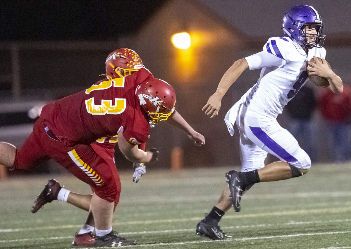Kamiakin’s Dylan Withers (53) attempts to sack Pasco’s quarterback Armani Reyes (9) as he runs with the ball during a Mid-Columbia Conference football game at Lampson Stadium in Kennewick on Friday. Kennewick defeated Pasco 43-25.