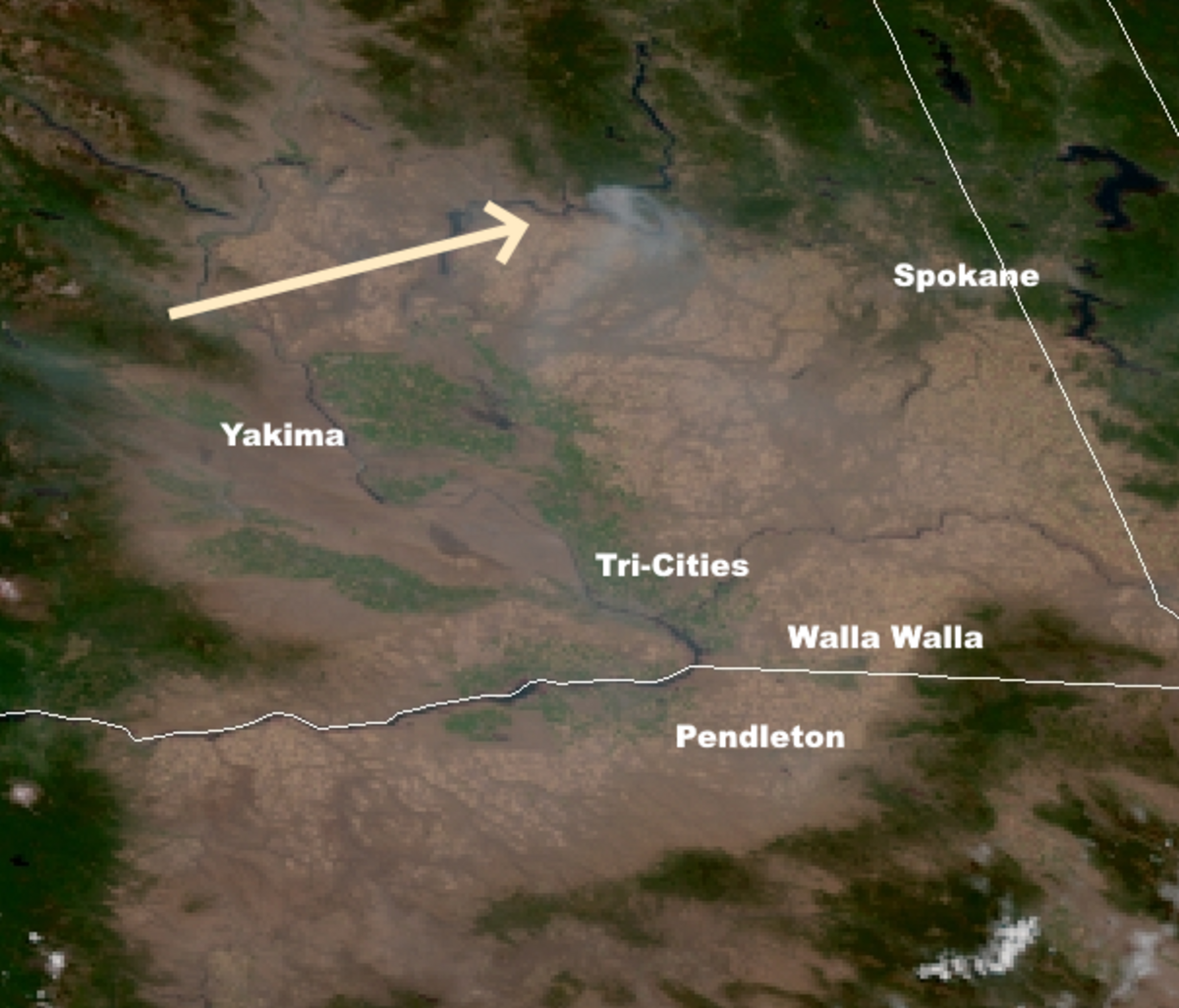 An arrow on a satellite photo shows where the Williams Flats Fire is burning north of the Tri-Cities.
