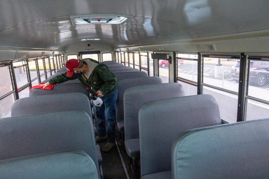 Richland elementary students started returning to partial in-person learning in October. Workers are regularly sanitizing school buses.