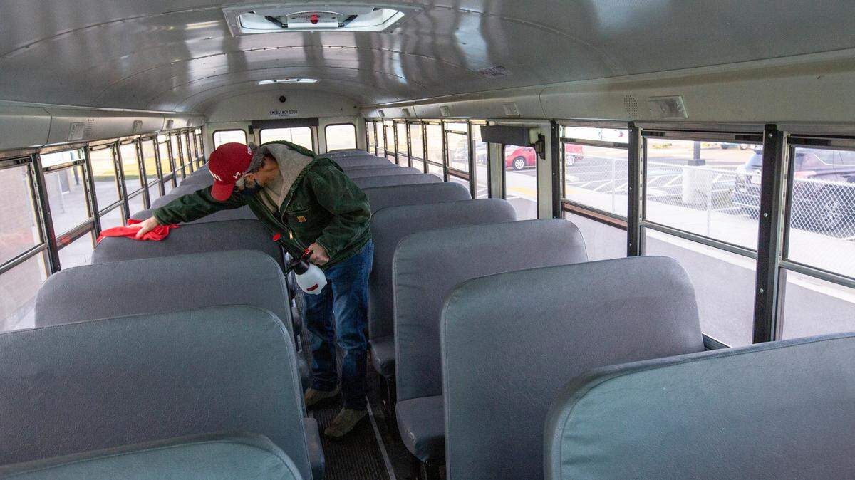 Richland elementary students started returning to partial in-person learning in October. Workers are regularly sanitizing school buses.