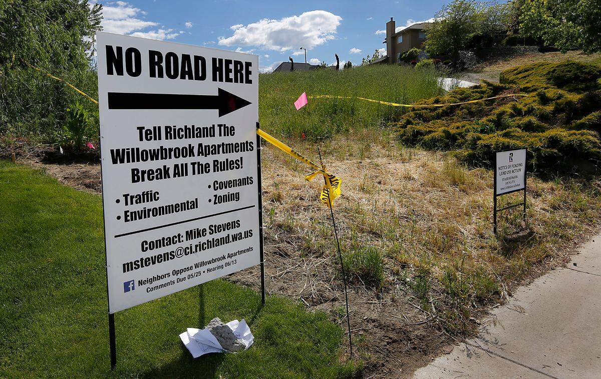 A sign in the yard of 321 Broadmoor Street in south Richland opposing the Willowbrook Apartment complex encourages feedback about the project to Richland officials before the comment period closed on May 25.