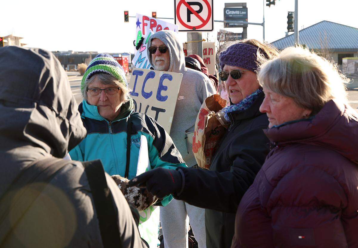 Denise Mean of Richland hands out whistles at a recent rally along George Washington Way in Richland.