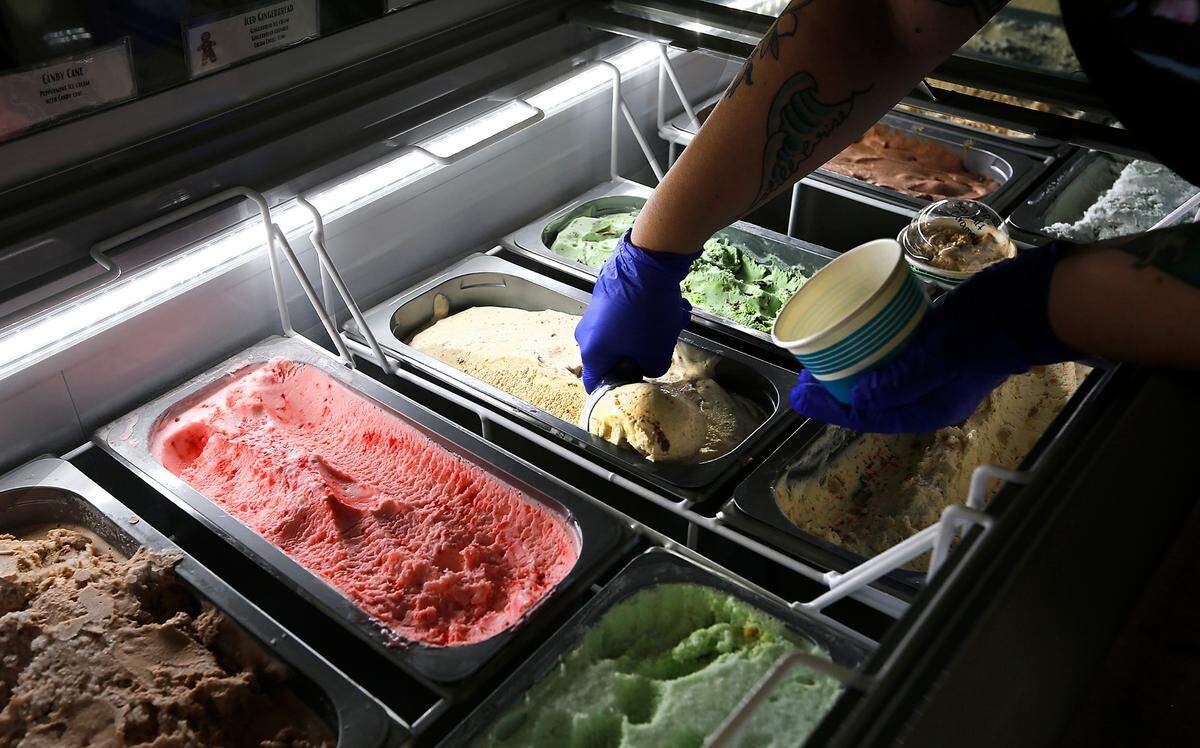 Mallory Chapin, owner of What’s the Scoop?, to fills a bowl with Mr. Maple ice cream at the new Kennewick store at 3902 W. Clearwater Ave. The store carries six traditional flavors and feature six unique rotating custom-made flavors inspired by Mallory’s husband, Rob, and made in small batches at the Walla Walla Cheese Company.