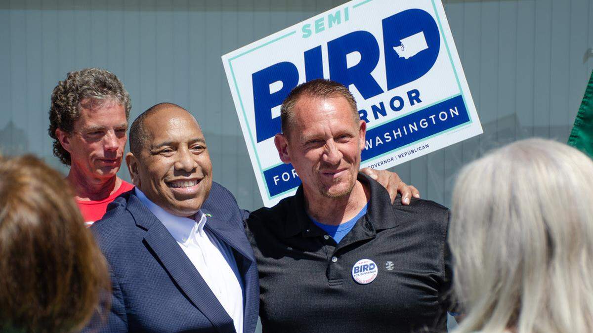 Washington gubernatorial candidate Semi Bird, a Republican from Richland, and Spokane County Republican Party Vice Chair Lyle Dach pose for a photo Friday, May 10, outside the Benton County Elections Office for a rally announcing Bird’s filing for the governor’s race.