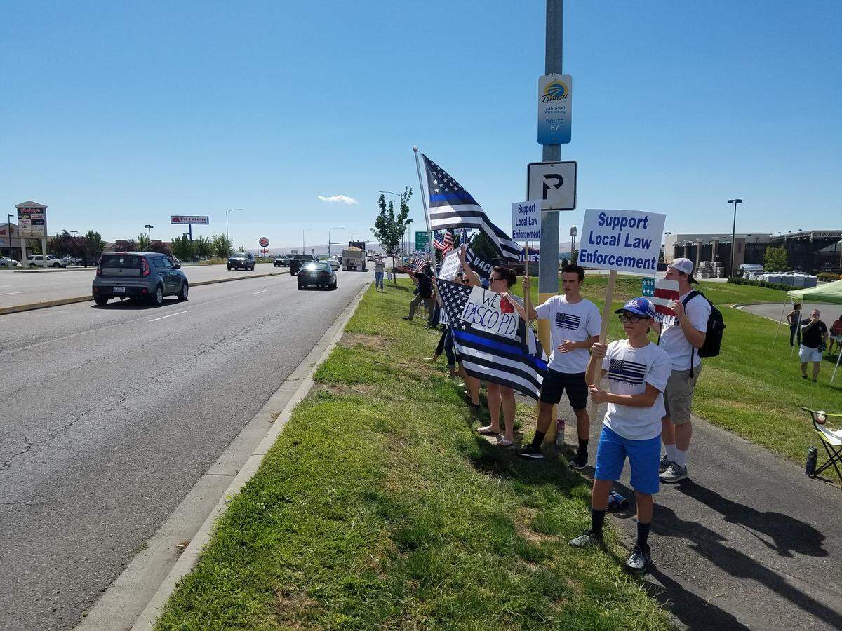 About 50 people rallied in support of Tri-Cities police departments on Saturday along Road 68 in Pasco. And about 75 Black Lives Matter supporters stood across the busy street taking their own stand against systemic injustice.