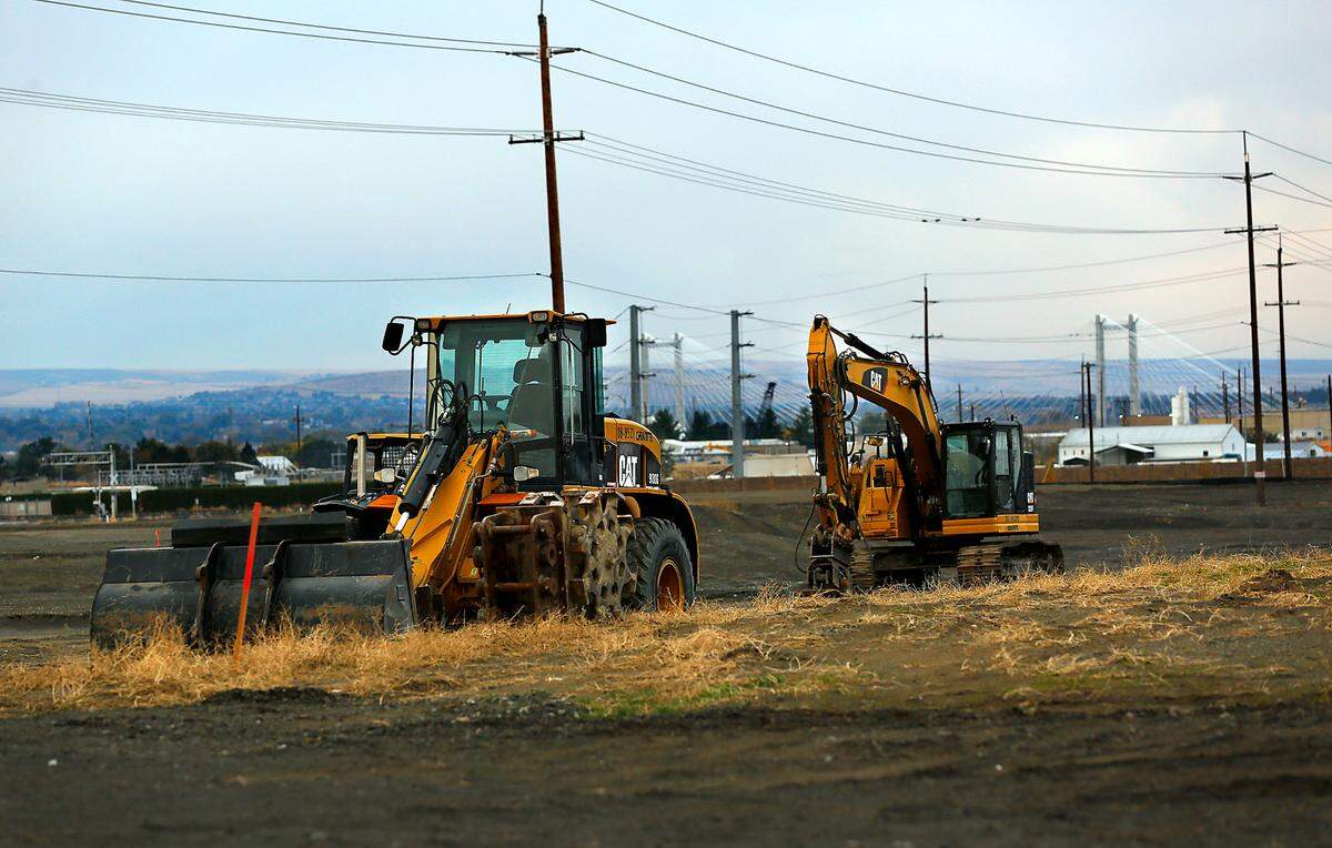 Heavy equipment sits idle at the site of the new Local Bounti greenhouse construction site on A Street near South Elm Avenue in Pasco.