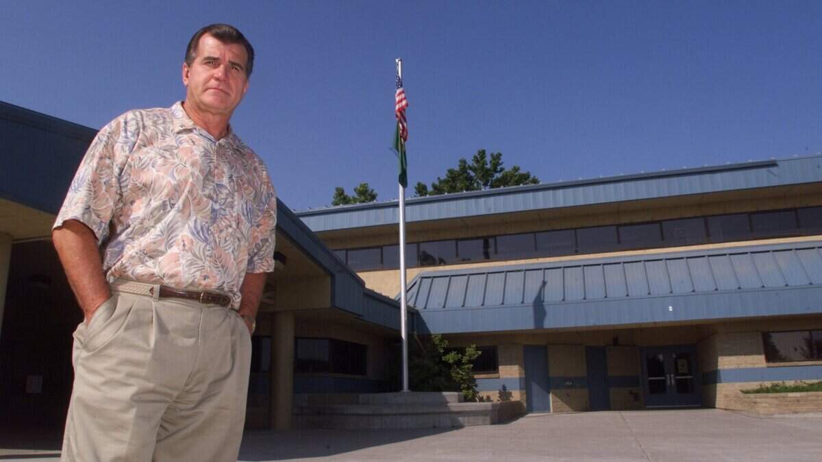 Tom Brandon, former director of operations for the Pasco School District, stands outside Longfellow Elementary School in Pasco in this 1999 file photo. He attended kindergarten at the first Longfellow Elementary in 1948.