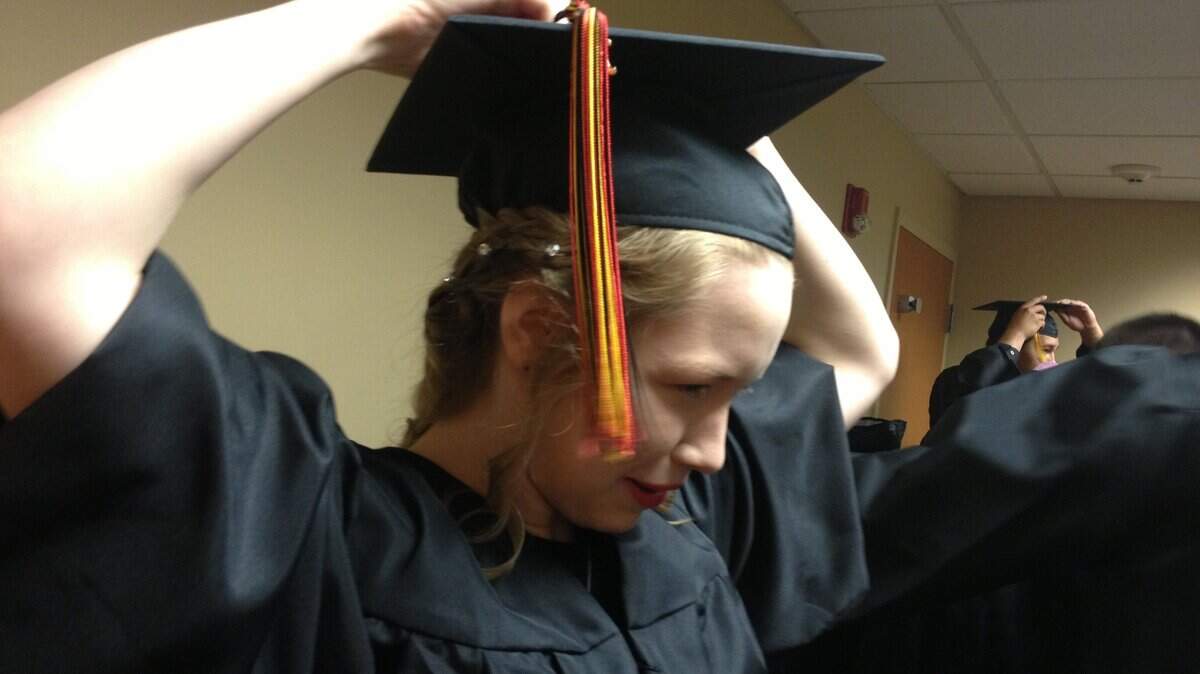 River's Edge graduate Haily Macki prepares Friday morning to join 27 of her classmates in the Richland school's commencement ceremony at the Three Rivers Convention Center.