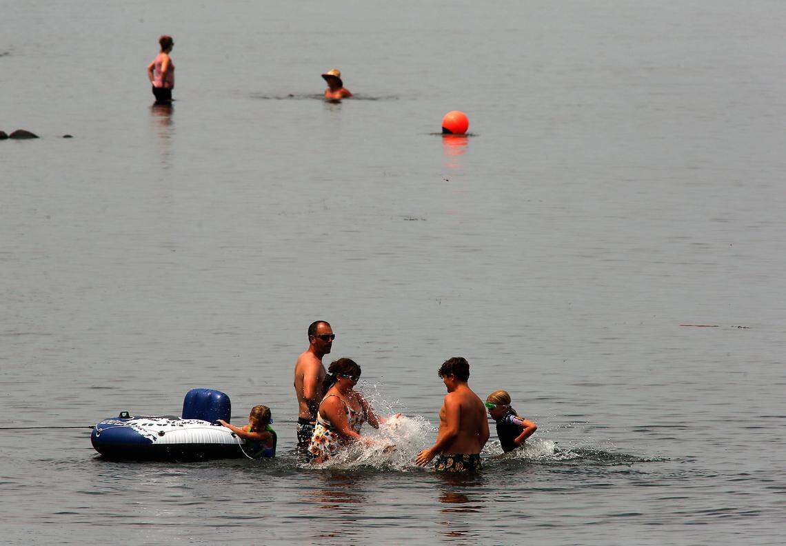 People cooled off in the Columbia River during the Tri-Cities Water Follies, with highs of 112 on Friday, 109 on Saturday and 105 on Sunday.
