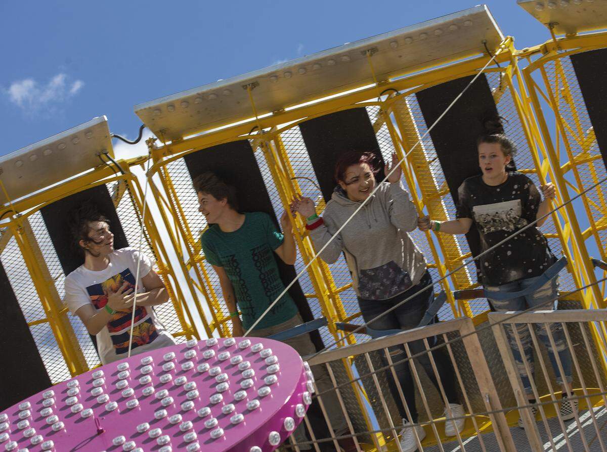 Fairgoers ride Thursday on the Zero Gravity at the Benton Franklin Fair & Rodeo in Kennewick. Zero Gravity is one of three new rides at the fair.