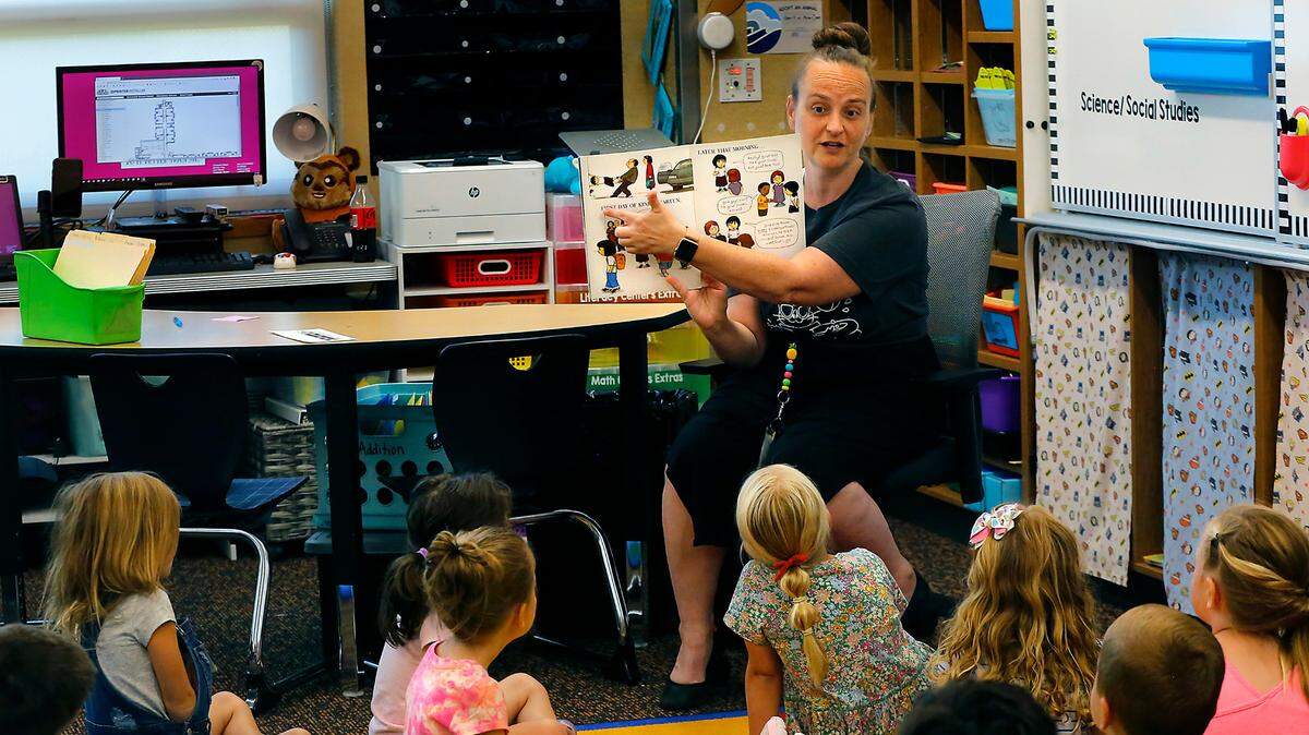 Teacher Nicole Hagner reads Countdown to Kindergarten to her students at Amon Creek Elementary School in Richland in 2022. The Pasco, Kennewick and Richland districts receive about $73 million annually in federal funds for public education and student welfare.