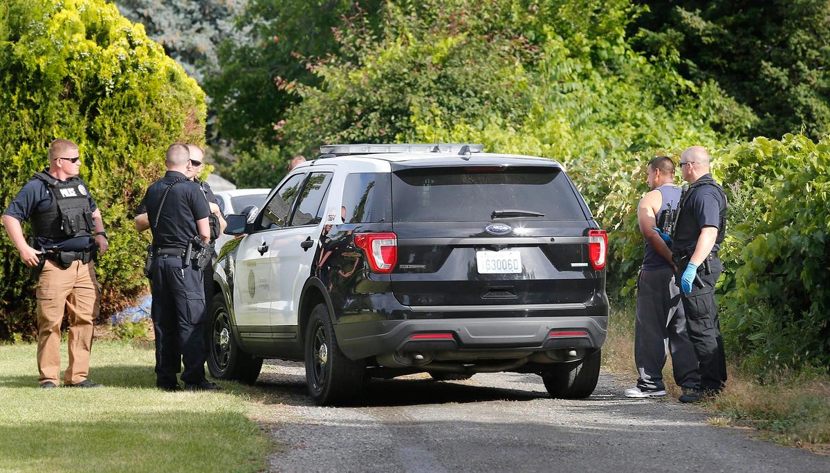 Members of the Kennewick Police Department’s Criminal Apprehension Team take Jimmy Lee Rodriguez into custody at a house in the 3500 block of South Garfield Street during Tuesday’s Operation Safe Streets II. Watch a video at: tricityherald.com/video