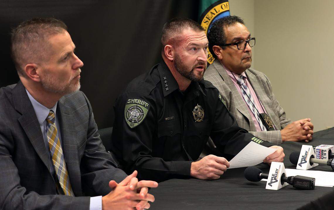 Benton County Prosecutor Eric Eisinger, interim Benton County Sheriff Mike Clark and Benton County Detective Sergeant Horacio Gonzalez, from left, hold a press conference Tuesday about the domestic violence murder suicide that happened Nov. 15 near Prosser.